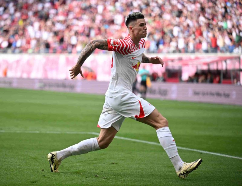LEIPZIG, GERMANY - APRIL 13: Benjamin Sesko of Leipzig celebrates scoring his team's second goal during the Bundesliga match between RB Leipzig and VfL Wolfsburg at Red Bull Arena on April 13, 2024 in Leipzig, Germany. (Photo by Stuart Franklin/Getty Images)