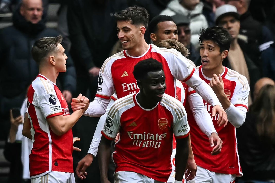 Arsenal's Kai Havertz (rear C) celebrates with teammates after scoring his team third goal during the English Premier League football match between Tottenham Hotspur and Arsenal at the Tottenham Hotspur Stadium in London, on April 28, 2024. (Photo by BEN STANSALL/AFP via Getty Images)