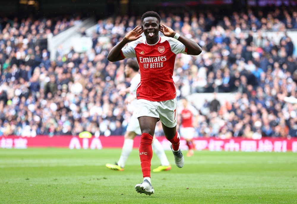 LONDON, ENGLAND: Bukayo Saka of Arsenal celebrates scoring his team's second goal during the Premier League match between Tottenham Hotspur and Arsenal FC at Tottenham Hotspur Stadium on April 28, 2024. (Photo by Clive Rose/Getty Images)