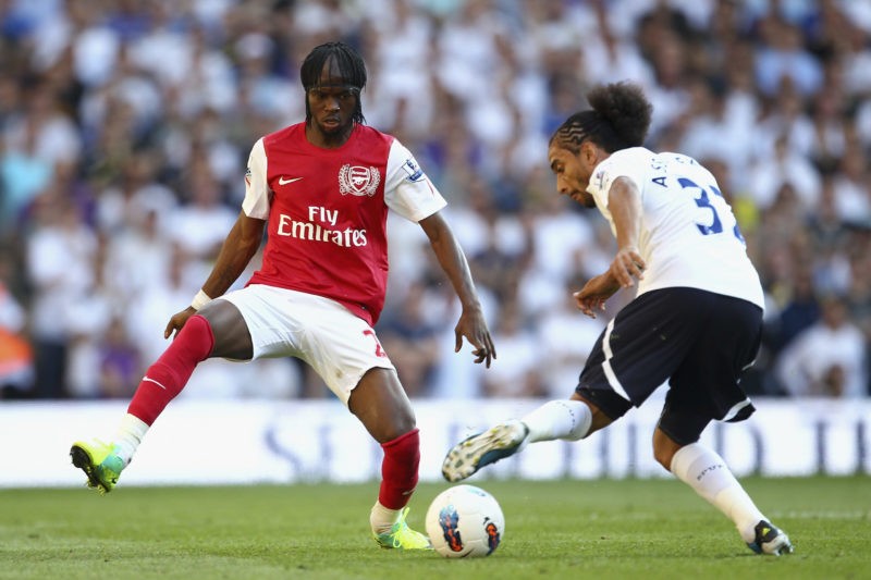 LONDON, ENGLAND - OCTOBER 02: Gervinho of Arsenal closes down Benoit Assou Ekotto of Tottenham Hotspur during the Barclays Premier League match between Tottenham Hotspur and Arsenal at White Hart Lane on October 2, 2011 in London, England. (Photo by Julian Finney/Getty Images)