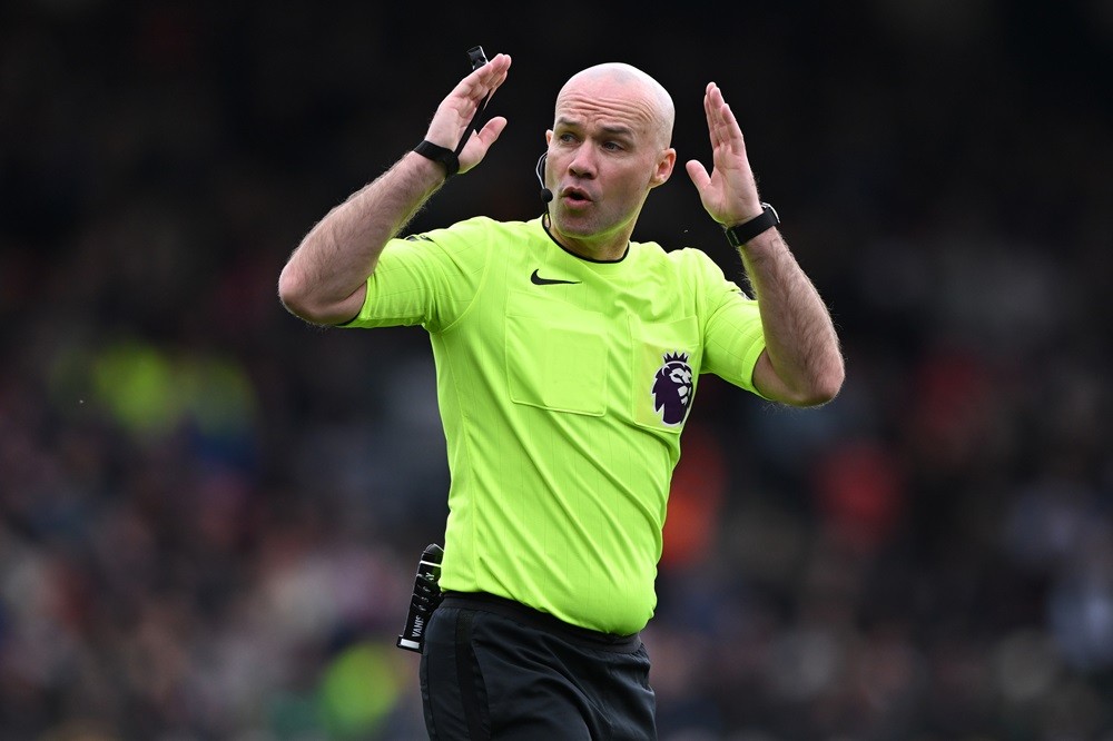 BOURNEMOUTH, ENGLAND: Referee Paul Tierney indicates a throw in during the Premier League match between AFC Bournemouth and Brighton & Hove Albion at Vitality Stadium on April 28, 2024. (Photo by Mike Hewitt/Getty Images)