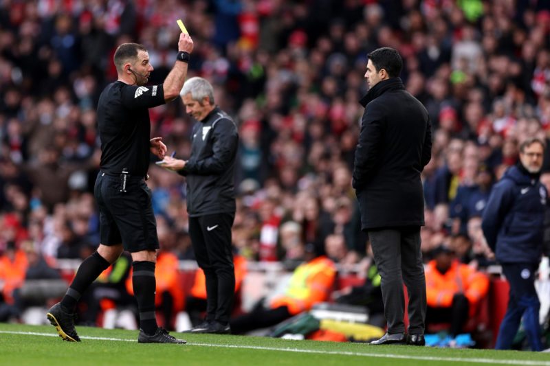 LONDON, ENGLAND - DECEMBER 17: Referee Tim Robinson shows a yellow card to Mikel Arteta, Manager of Arsenal, during the Premier League match between Arsenal FC and Brighton & Hove Albion at Emirates Stadium on December 17, 2023 in London, England. (Photo by Richard Heathcote/Getty Images)