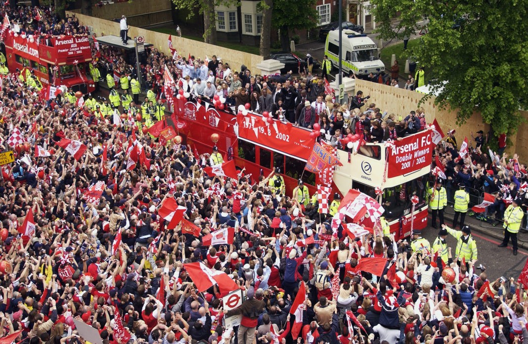LONDON - MAY 12: Arsenal parade their trophies during Arsenal's open top bus parade of the AXA FA Cup and the FA Barclaycard Premiership trophy to their fans held on May 12, 2002 at the Islington Town Hall in London, England. (Photo by: Craig Prentis/Getty Images)