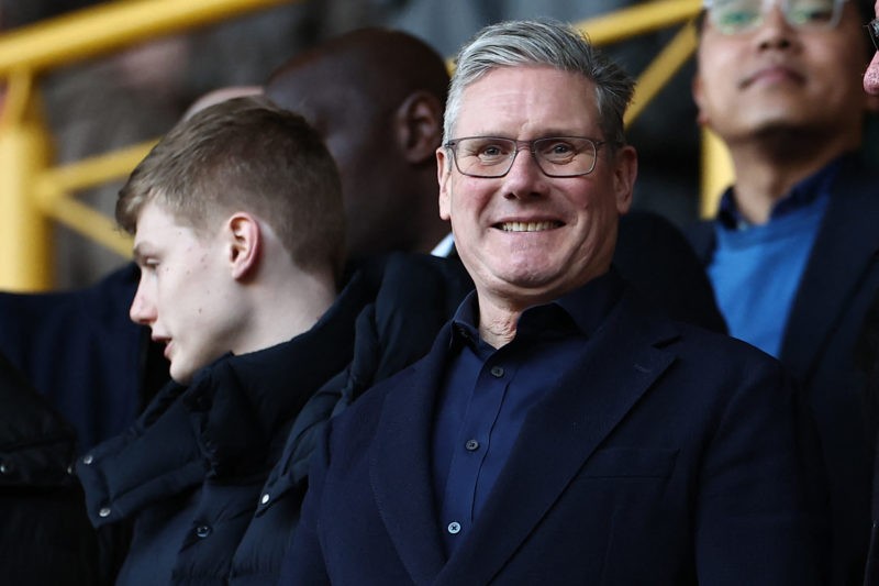 Britain's main opposition Labour Party leader Keir Starmer takes his seat for the English Premier League football match between Wolverhampton Wanderers and Arsenal at the Molineux stadium in Wolverhampton, central England on April 20, 2024. (Photo by HENRY NICHOLLS/AFP via Getty Images)