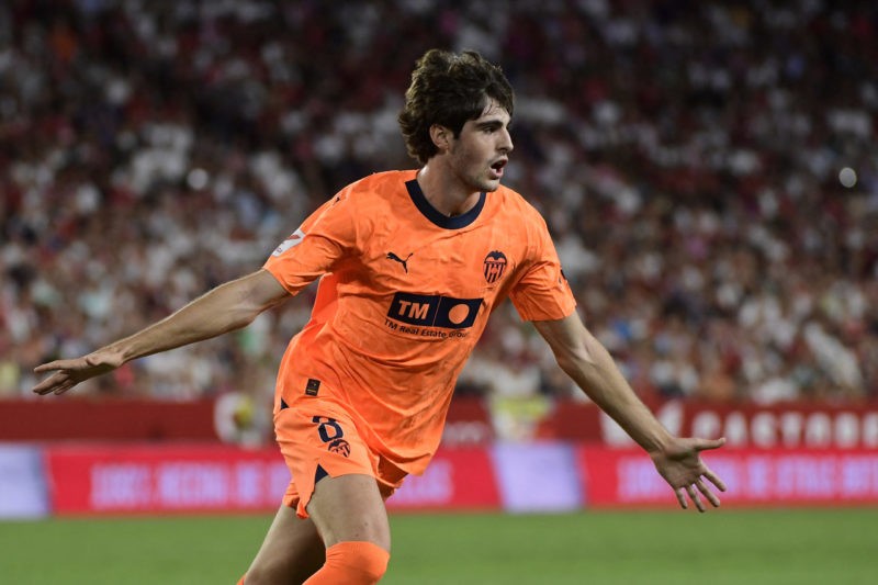 Valencia's Spanish midfielder #8 Javi Guerra celebrates scoring his team's second goal during the Spanish Liga football match between Sevilla FC and Valencia CF at the Ramon Sanchez Pizjuan stadium in Seville on August 11, 2023. (Photo by CRISTINA QUICLER/AFP via Getty Images)