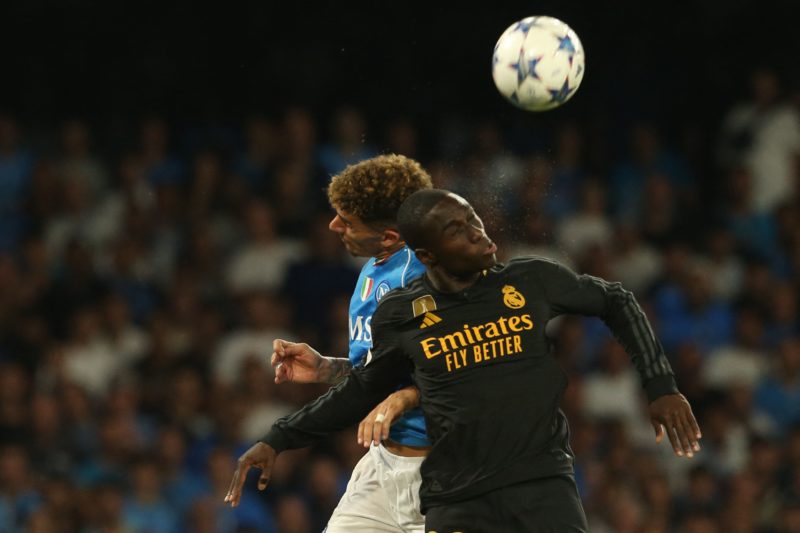 Real Madrid's French defender #23 Ferland Mendy (R) heads the ball during the UEFA Champions League 1st round day 2 Group C football match Napoli vs Real Madrid at the Diego Armando Maradona stadium in Naples on October 3, 2023. (Photo by CARLO HERMANN/AFP via Getty Images)