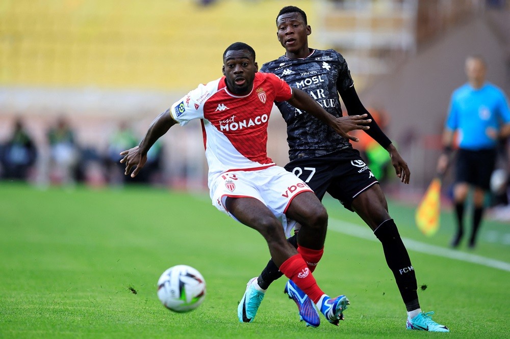 Monaco's Youssouf Fofana (L) fights for the ball with Metz's Danley Jean Jacques (R) during the French L1 football match between AS Monaco and FC Metz at the Louis II Stadium (Stade Louis II) in the Principality of Monaco on October 22, 2023. (Photo by VALERY HACHE/AFP via Getty Images)