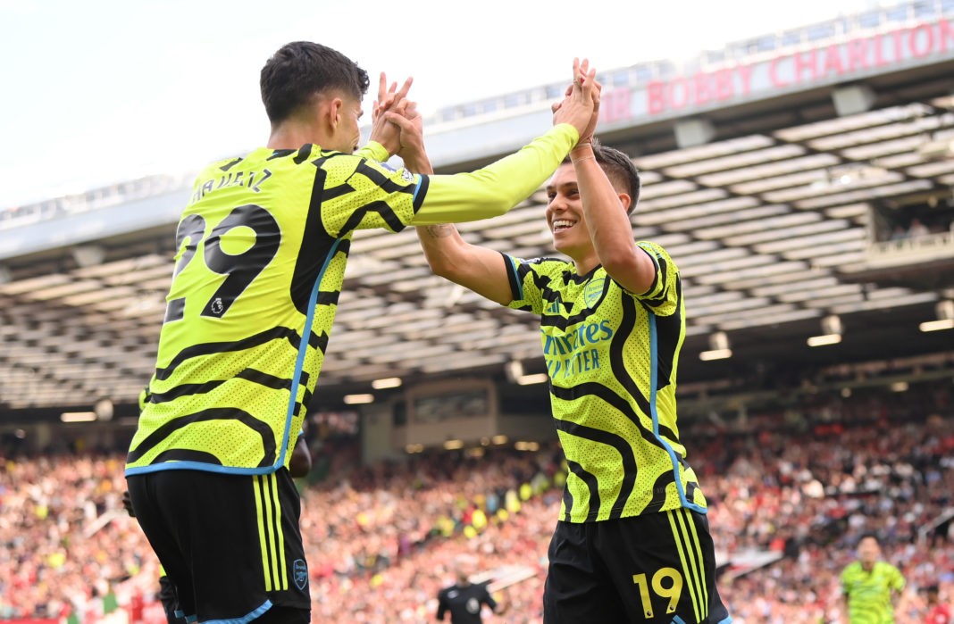 MANCHESTER, ENGLAND - MAY 12: Leandro Trossard of Arsenal celebrates scoring his team's first goal with teammate Kai Havertz during the Premier League match between Manchester United and Arsenal FC at Old Trafford on May 12, 2024 in Manchester, England. (Photo by Stu Forster/Getty Images)