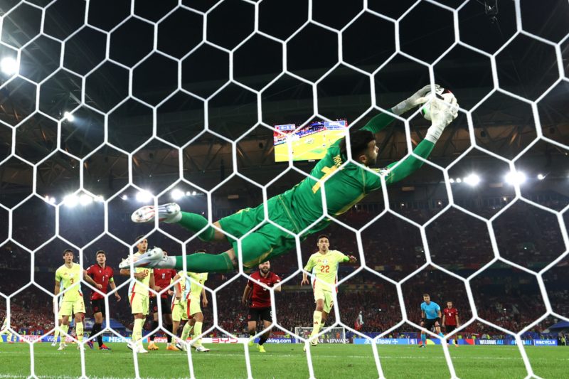 DUSSELDORF, GERMANY - JUNE 24: (EDITORS NOTE: Image was captured using a static remote camera behind the goal.) David Raya of Spain saves a shot during the UEFA EURO 2024 group stage match between Albania and Spain at Düsseldorf Arena on June 24, 2024 in Dusseldorf, Germany. (Photo by Kevin C. Cox/Getty Images)