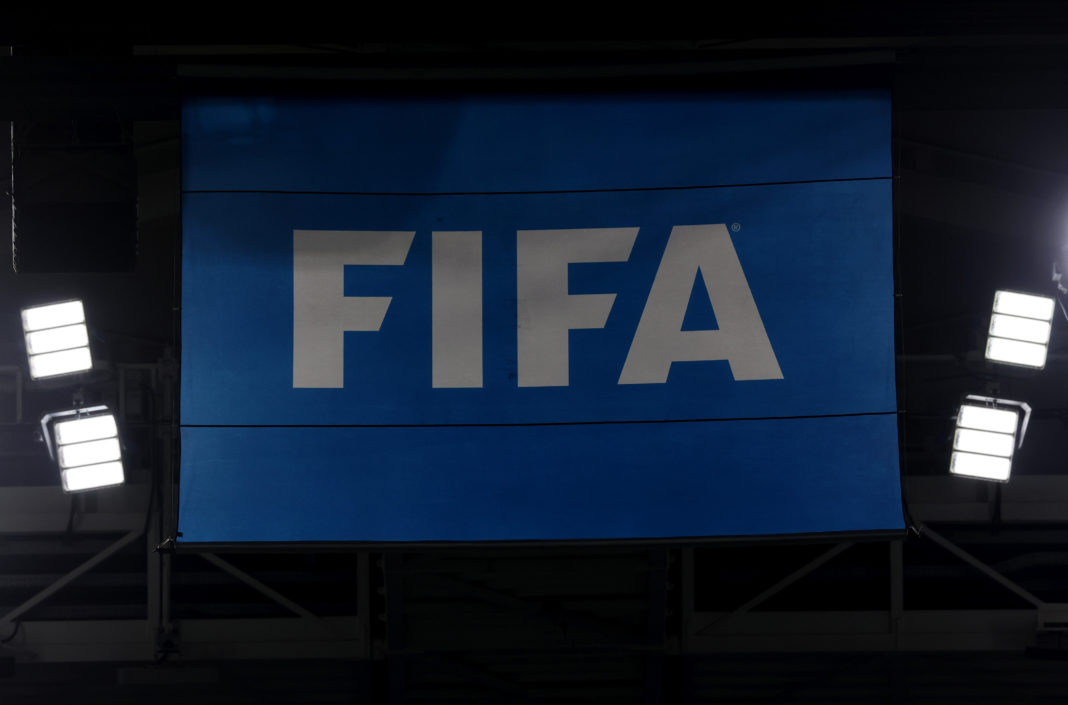 DOHA, QATAR - DECEMBER 01: View of the FIFA logo on a flag during the FIFA World Cup Qatar 2022 Group F match between Canada and Morocco at Al Thumama Stadium on December 01, 2022 in Doha, Qatar. (Photo by Catherine Ivill/Getty Images)