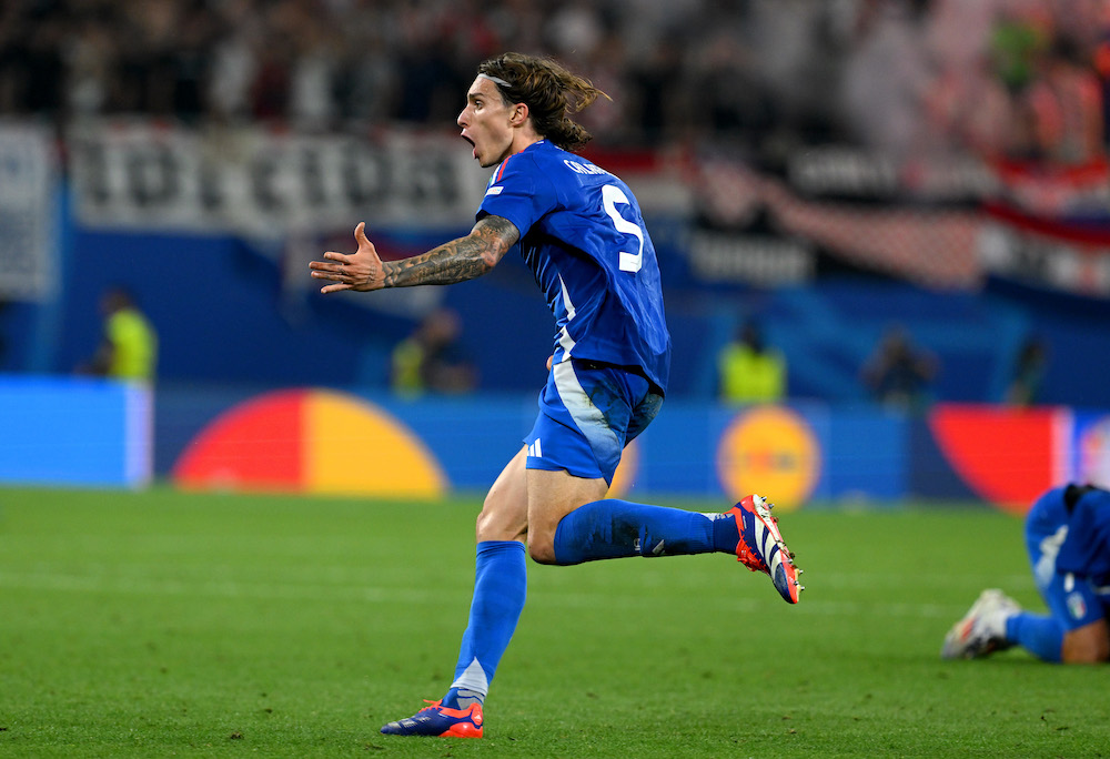 LEIPZIG, GERMANY: Riccardo Calafiori of Italy celebrates after Mattia Zaccagni of Italy (not pictured) scores his team's first goal during the UEFA EURO 2024 group stage match between Croatia and Italy at Football Stadium Leipzig on June 24, 2024. (Photo by Claudio Villa/Getty Images for FIGC)