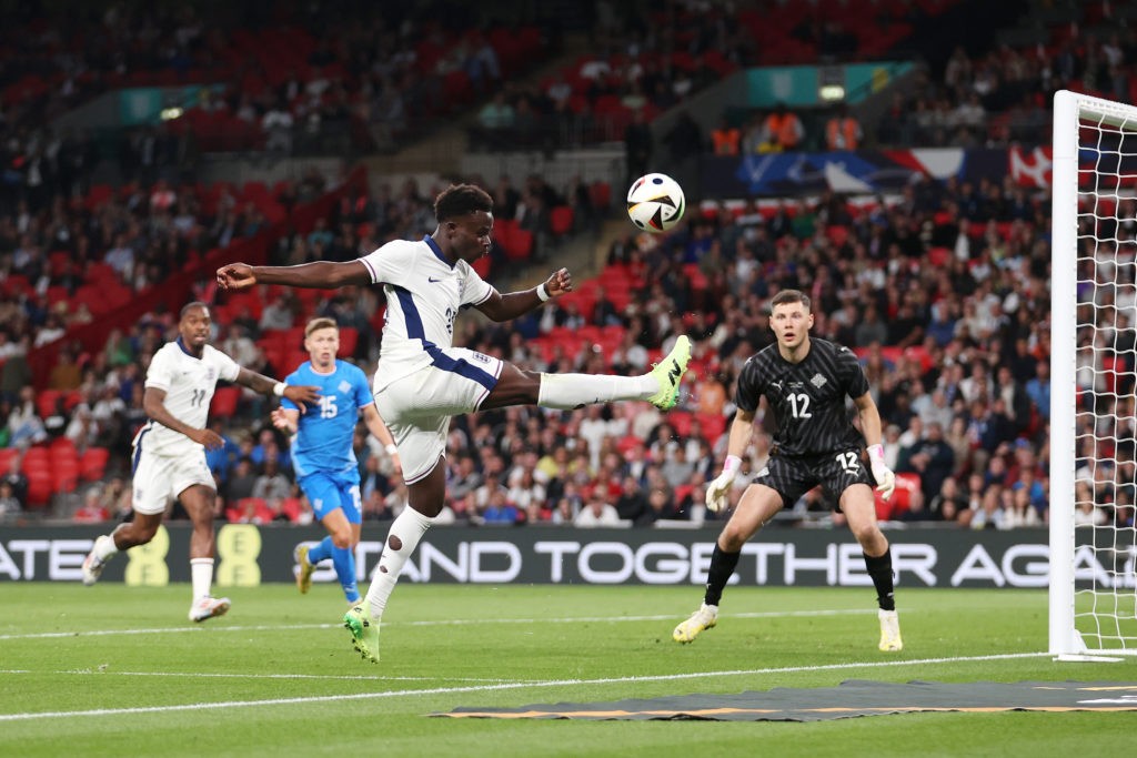 LONDON, ENGLAND - JUNE 07: Bukayo Saka of England attempts to keep the ball in play during the international friendly match between England and Iceland at Wembley Stadium on June 07, 2024 in London, England. (Photo by Julian Finney/Getty Images)