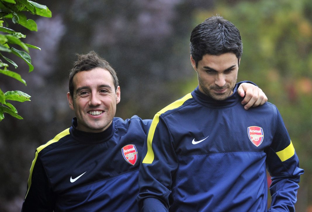 Arsenal's Spanish midfielder Santi Cazorla (L) and Spanish midfielder Mikel Arteta (R) attend training for the forthcoming UEFA Champions League group B football match against FC Schalke 04 at Arsenal's training ground, London Colney, North London, England on October 23, 2012. (Photo credit GLYN KIRK/AFP via Getty Images)