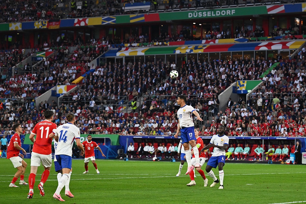 France's William Saliba heads the ball during the UEFA Euro 2024 Group D football match between Austria and France at the Duesseldorf Arena in Duesseldorf on June 17, 2024. (Photo by OZAN KOSE/AFP via Getty Images)