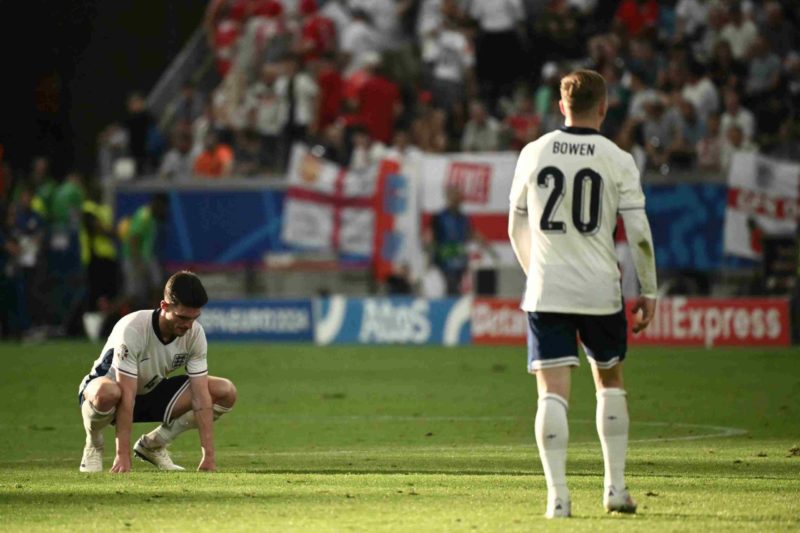 England's midfielder #04 Declan Rice (L) and England's forward #20 Jarrod Bowen react after the UEFA Euro 2024 Group C football match between Denmark and England at the Frankfurt Arena in Frankfurt am Main on June 20, 2024. (Photo by Angelos Tzortzinis / AFP) (Photo by ANGELOS TZORTZINIS/AFP via Getty Images)
