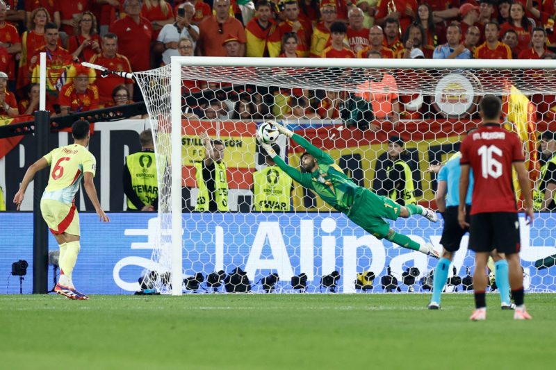 Spain's goalkeeper #01 David Raya holds onto a shot during the UEFA Euro 2024 Group B football match between Albania and Spain at the Duesseldorf Arena in Duesseldorf on June 24, 2024. (Photo by KENZO TRIBOUILLARD/AFP via Getty Images)