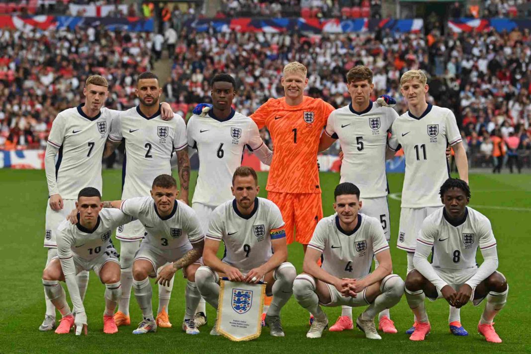 (L-R back row) England's midfielder #07 Cole Palmer, England's defender #02 Kyle Walker, England's defender #06 Marc Guehi, England's goalkeeper #01 Aaron Ramsdale, England's defender #05 John Stones and England's midfielder #11 Anthony Gordon, (L-R front row) England's midfielder #10 Phil Foden, England's defender #03 Kieran Trippier, England's striker #09 Harry Kane, England's midfielder #04 Declan Rice and England's midfielder #08 Kobbie Mainoo pose for a photo ahead of kick-off in the International friendly football match between England and Iceland at Wembley Stadium in London on June 7, 2024. (Photo by GLYN KIRK/AFP via Getty Images)