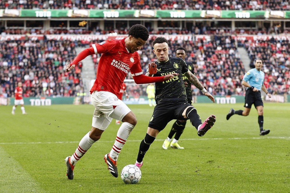 PSV's Malik Tillman (L) fights for the ball with Feyenoord's Quilindschy Hartman (R) during the Dutch Eredivisie football match between PSV Eindhoven and Feyenoord at the Phillips stadium, in Eindhoven, Netherlands on March 3, 2024. (Photo by MAURICE VAN STEEN/ANP/AFP via Getty Images)