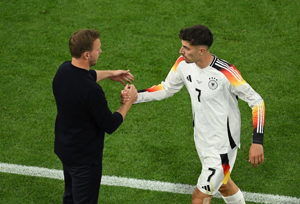 MUNICH, GERMANY: Kai Havertz of Germany shakes hands with Julian Nagelsmann, Head Coach of Germany, after being substituted during the UEFA EURO 2024 group stage match between Germany and Scotland at Munich Football Arena on June 14, 2024. (Photo by Clive Mason/Getty Images)