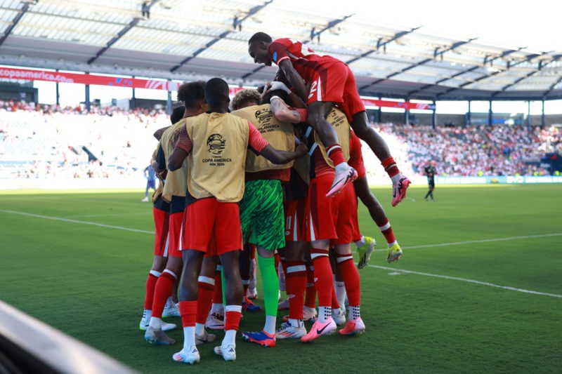KANSAS CITY, KANSAS - JUNE 25: Jonathan David of Canada celebrates with teammates after scoring the team's first goal during the CONMEBOL Copa America 2024 between Peru and Canada at Children's Mercy Park on June 25, 2024 in Kansas City, Kansas. (Photo by Hector Vivas/Getty Images)