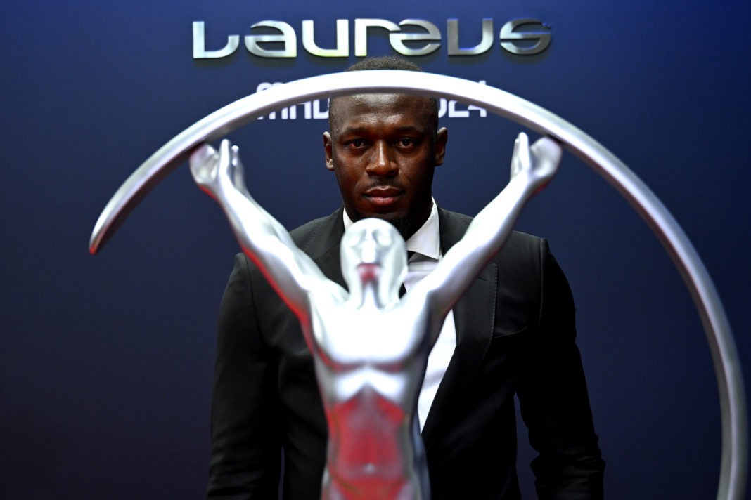 MADRID, SPAIN - APRIL 22: Usain Bolt poses with the Laureus trophy and wreath on the red carpet during the Laureus World Sports Awards at Galería De Cristal on April 22, 2024 in Madrid, Spain. (Photo by Borja B. Hojas/Getty Images)