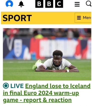 Bukayo Saka lying on the ground during a match, with the BBC Sport headline "LIVE England lose to Iceland in final Euro 2024 warm-up game - report & reaction."