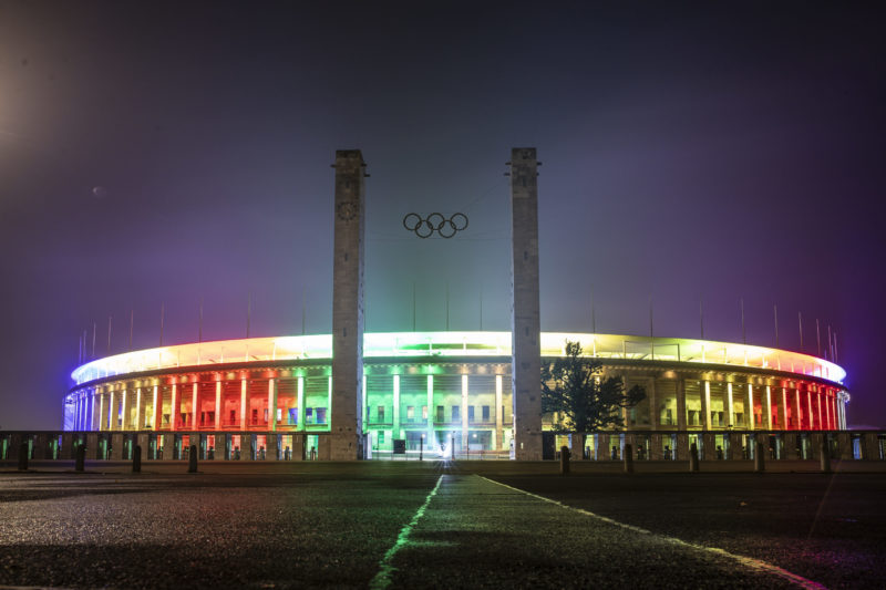 BERLIN, GERMANY - OCTOBER 05: Olympiastadion is lit in colors after a presentation of the new UEFA Euro 2024 football championship logo at Olympiastadion on October 05, 2021 in Berlin, Germany. (Photo by Maja Hitij/Getty Images)
