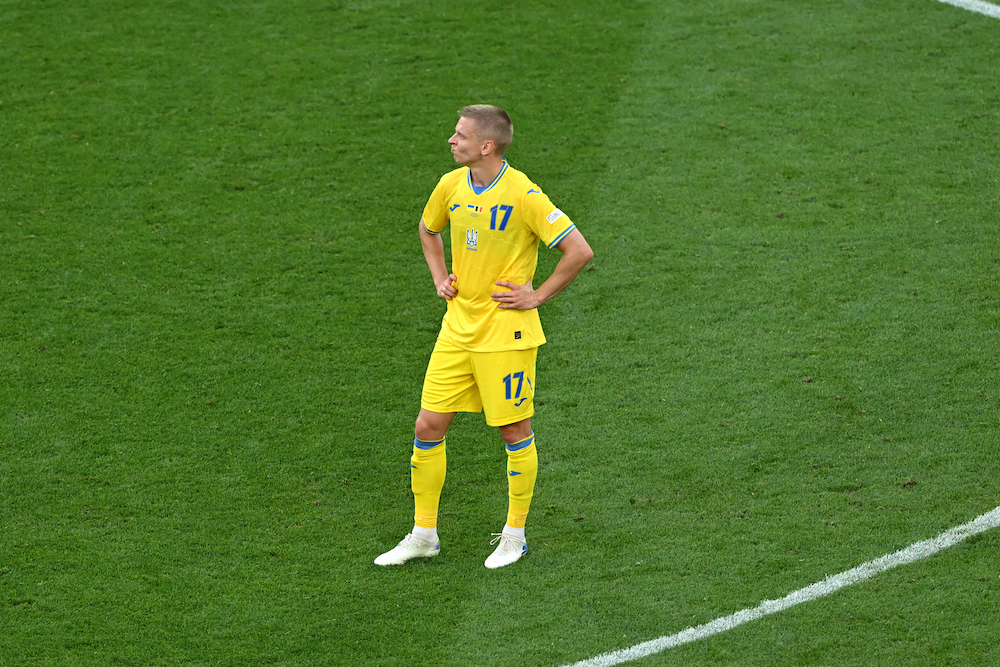 STUTTGART, GERMANY: Oleksandr Zinchenko of Ukraine looks dejected as Ukraine are eliminated from EURO 2024 after finishing in fourth place in Group E, after the UEFA EURO 2024 group stage match between Ukraine and Belgium at Stuttgart Arena on June 26, 2024. (Photo by Shaun Botterill/Getty Images)