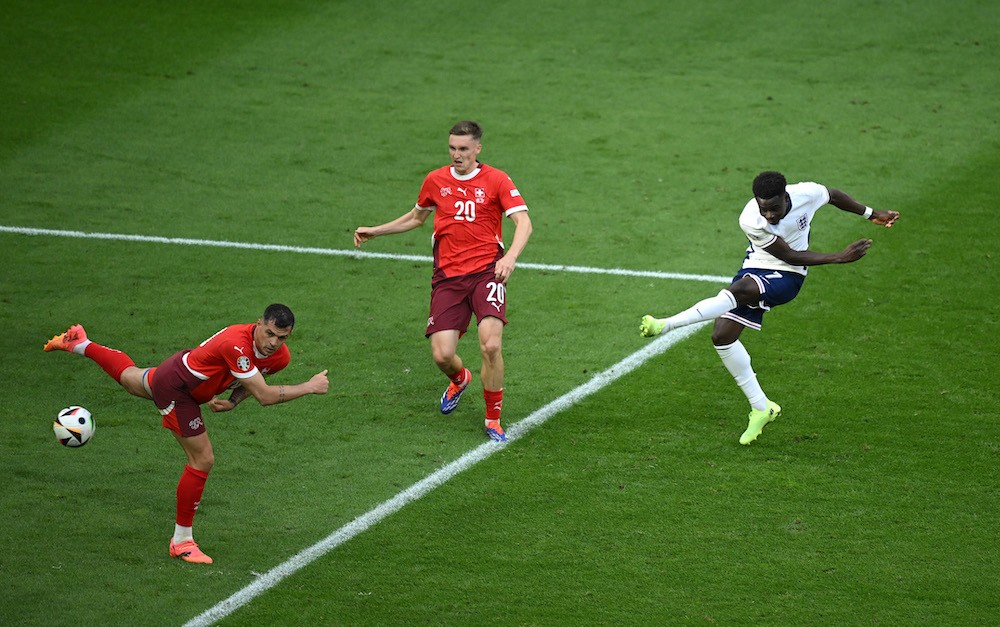 DUSSELDORF, GERMANY: Bukayo Saka of England scores his team's first goal during the UEFA EURO 2024 quarter-final match between England and Switzerland at Düsseldorf Arena on July 06, 2024. (Photo by Clive Mason/Getty Images)