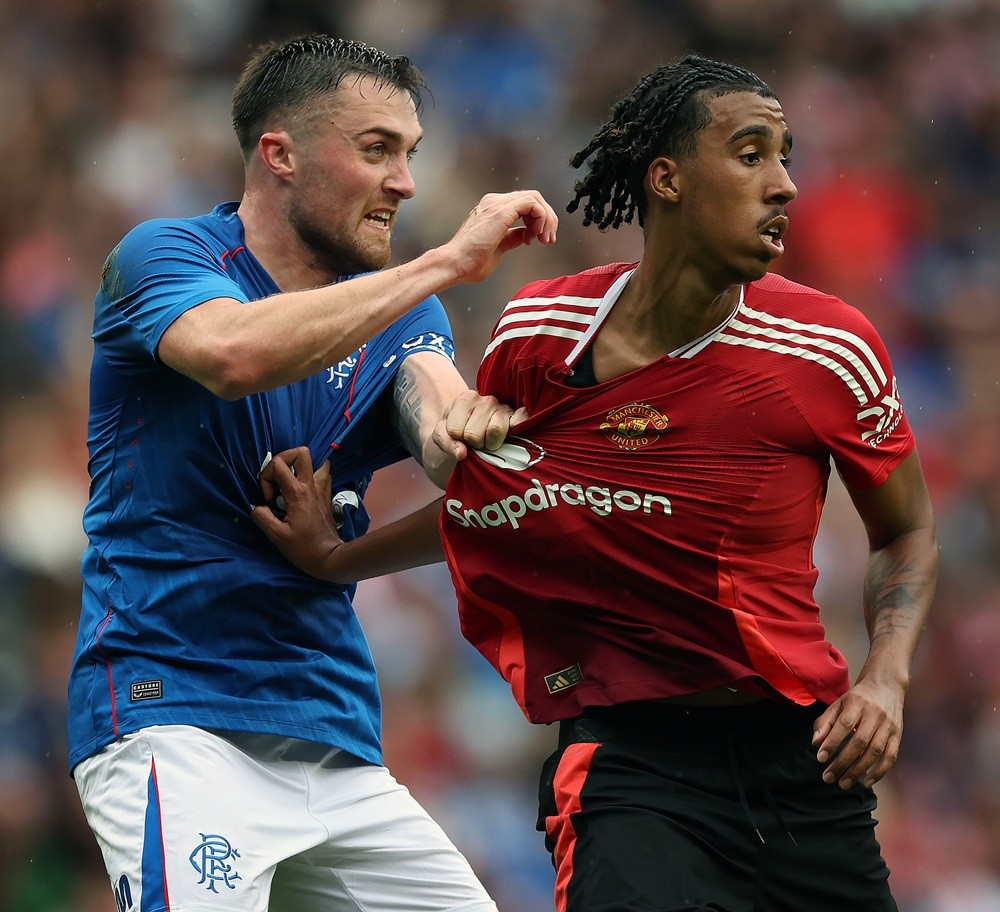 EDINBURGH, SCOTLAND: John Souttar of Rangers vies with Leny Yoro of Manchester United during Manchester United v Rangers - Pre-Season Friendly at BT Murrayfield Stadium on July 20, 2024. (Photo by Ian MacNicol/Getty Images)