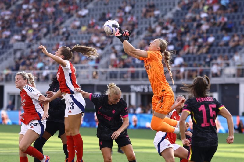 WASHINGTON, DC - AUGUST 25: Hannah Hampton #24 of Chelsea punches Arsenal corner kick during the second half against Arsenal at Audi Field on August 25, 2024 in Washington, DC. (Photo by Tim Nwachukwu/Getty Images)