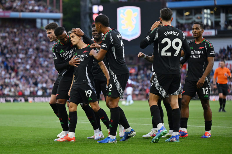 BIRMINGHAM, ENGLAND - AUGUST 24: Leandro Trossard of Arsenal celebrates scoring his team's first goal with teammates during the Premier League match between Aston Villa FC and Arsenal FC at Villa Park on August 24, 2024 in Birmingham, England. (Photo by Shaun Botterill/Getty Images)