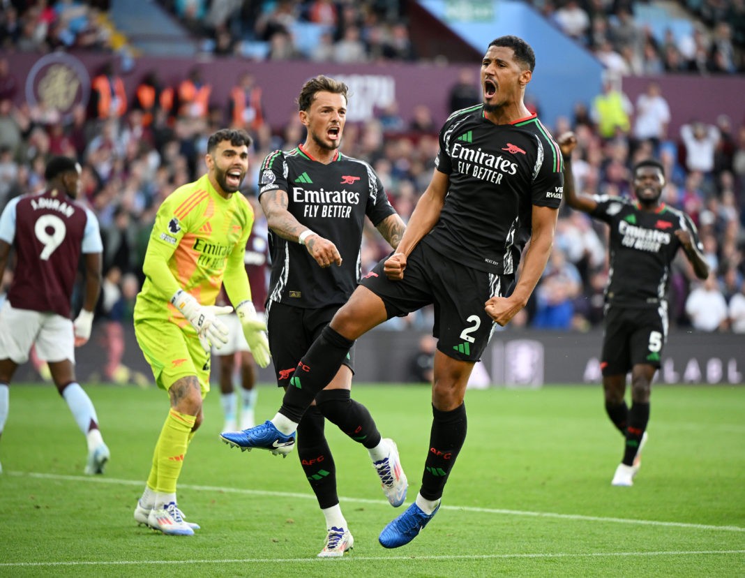 BIRMINGHAM, ENGLAND - AUGUST 24: William Saliba of Arsenal celebrates, after Thomas Partey of Arsenal (not pictured) scores his team's first goal during the Premier League match between Aston Villa FC and Arsenal FC at Villa Park on August 24, 2024 in Birmingham, England. (Photo by Clive Mason/Getty Images)