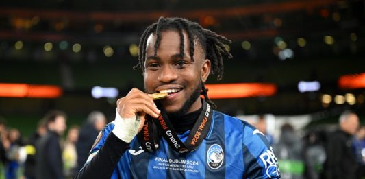 DUBLIN, IRELAND: Ademola Lookman of Atalanta BC bites his winner's medal as he celebrates victory after the UEFA Europa League 2023/24 final match between Atalanta BC and Bayer 04 Leverkusen at Dublin Arena on May 22, 2024. (Photo by Michael Regan/Getty Images)