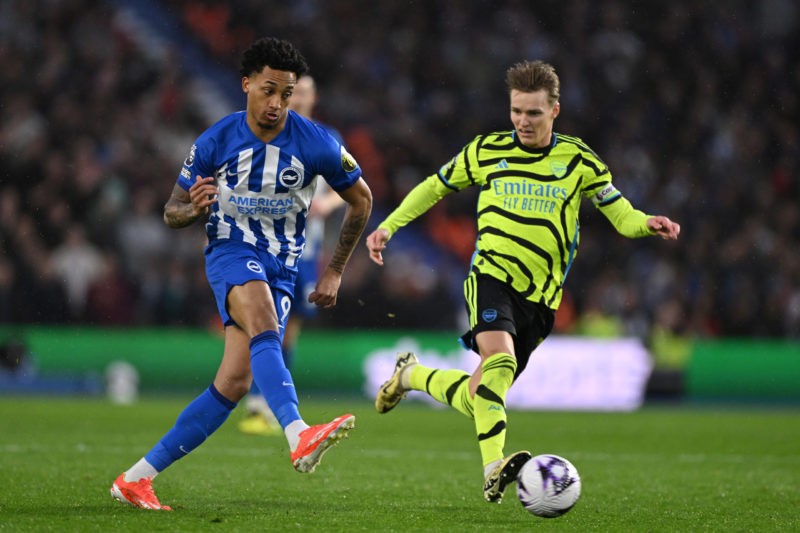 BRIGHTON, ENGLAND - APRIL 06: Joao Pedro of Brighton is challenged by Martin Odegaard of Arsenal during the Premier League match between Brighton & Hove Albion and Arsenal FC at American Express Community Stadium on April 06, 2024 in Brighton, England. (Photo by Mike Hewitt/Getty Images)