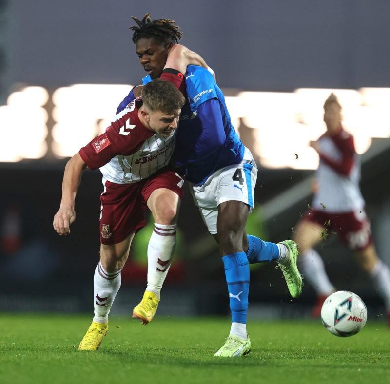 CHESTERFIELD, ENGLAND - NOVEMBER 05: Sam Hoskins of Northampton Town is held by Tim Akinola of Chesterfieldas he attempts to move forward with the ball during the Emirates FA Cup First Round match between Chesterfield and Northampton Town at Technique Stadium on November 05, 2022 in Chesterfield, England. (Photo by Pete Norton/Getty Images)