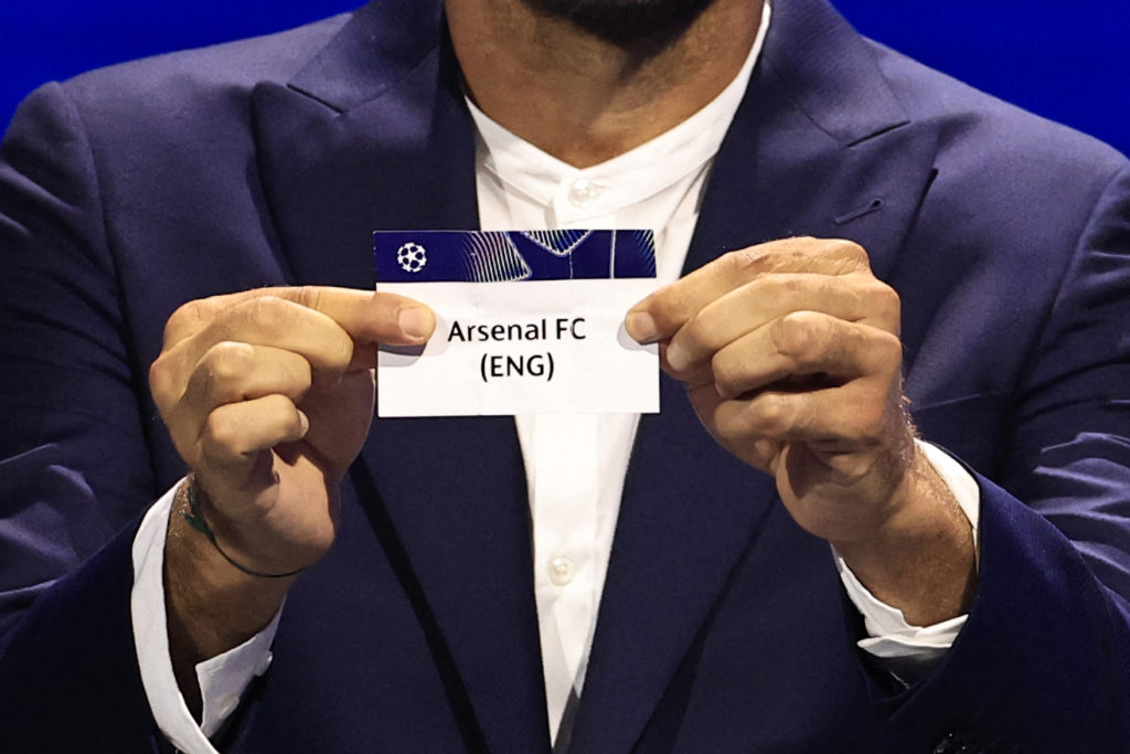 Italy's former goalkeeper Gianluigi Buffon shows the paper slip of Arsenal (ENG) during the group stage of the 2024-2025 UEFA Champions League football tournament, at the Grimaldi Forum in Monaco on August 29, 2024. (Photo by VALERY HACHE/AFP via Getty Images)