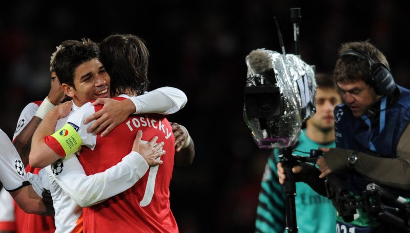 Shakhtar Donetsk's Eduardo (L) and former Arsenal player hugs Arsenal's Czech midfielder Tomas Rosicky (2nd L) at the final whistle during the UEFA Champions League Group H football match at The Emirates Stadium in London on October 19, 2010. Arsenal won the game 5-1. AFP (Photo ADRIAN DENNIS/AFP via Getty Images)