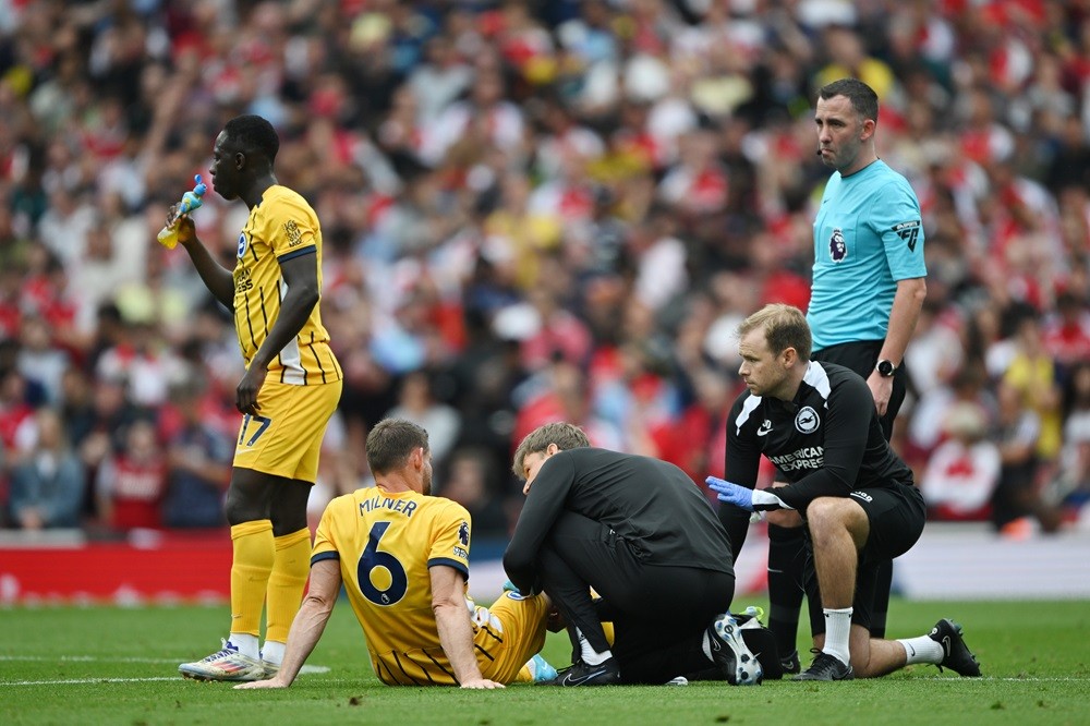 LONDON, ENGLAND: James Milner of Brighton & Hove Albion receives medical treatment before being substituted off due to injury during the Premier League match between Arsenal FC and Brighton & Hove Albion FC at Emirates Stadium on August 31, 2024. (Photo by Mike Hewitt/Getty Images)