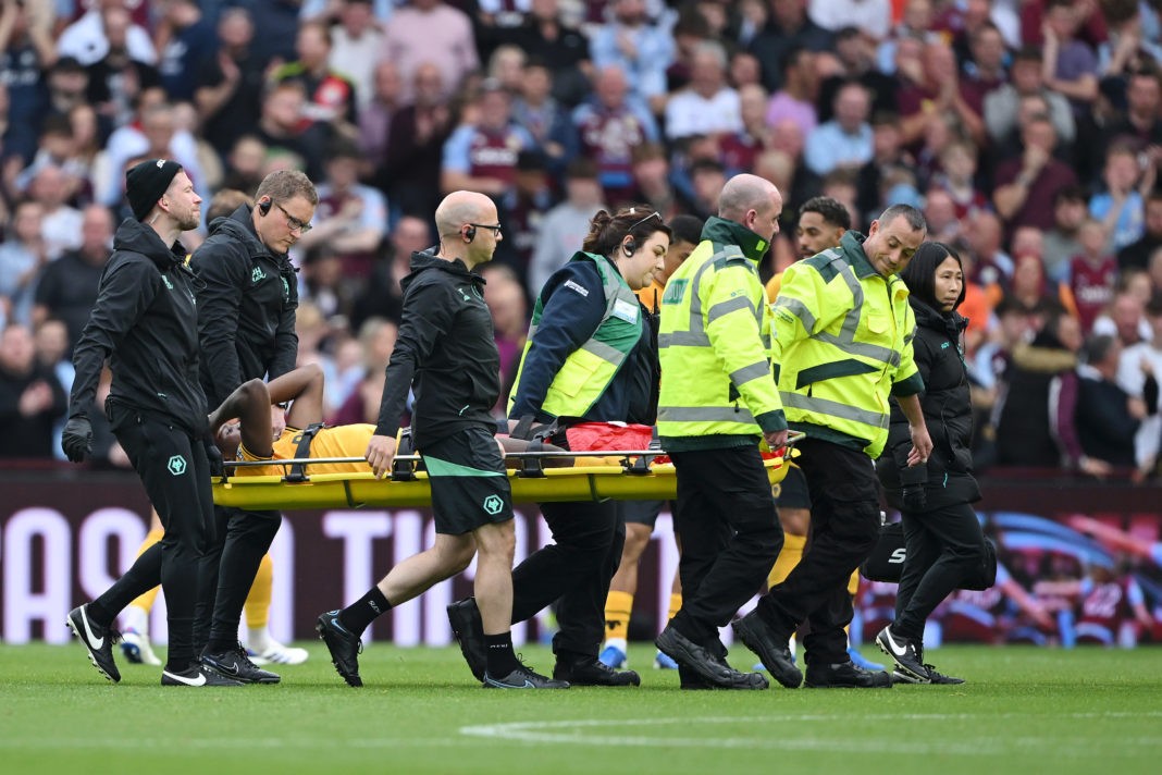 BIRMINGHAM, ENGLAND - SEPTEMBER 21: Yerson Mosquera of Wolverhampton Wanderers receives medical treatment during the Premier League match between Aston Villa FC and Wolverhampton Wanderers FC at Villa Park on September 21, 2024 in Birmingham, England. (Photo by Shaun Botterill/Getty Images)