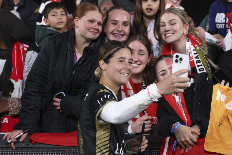 Arsenal's Kyra Cooney-Cross poses for a selfie with fans after the end of the women's football friendly match between Arsenal and the A-League All Stars at Marvel Stadium in Melbourne on May 24, 2024. (Photo by Martin KEEP / AFP)