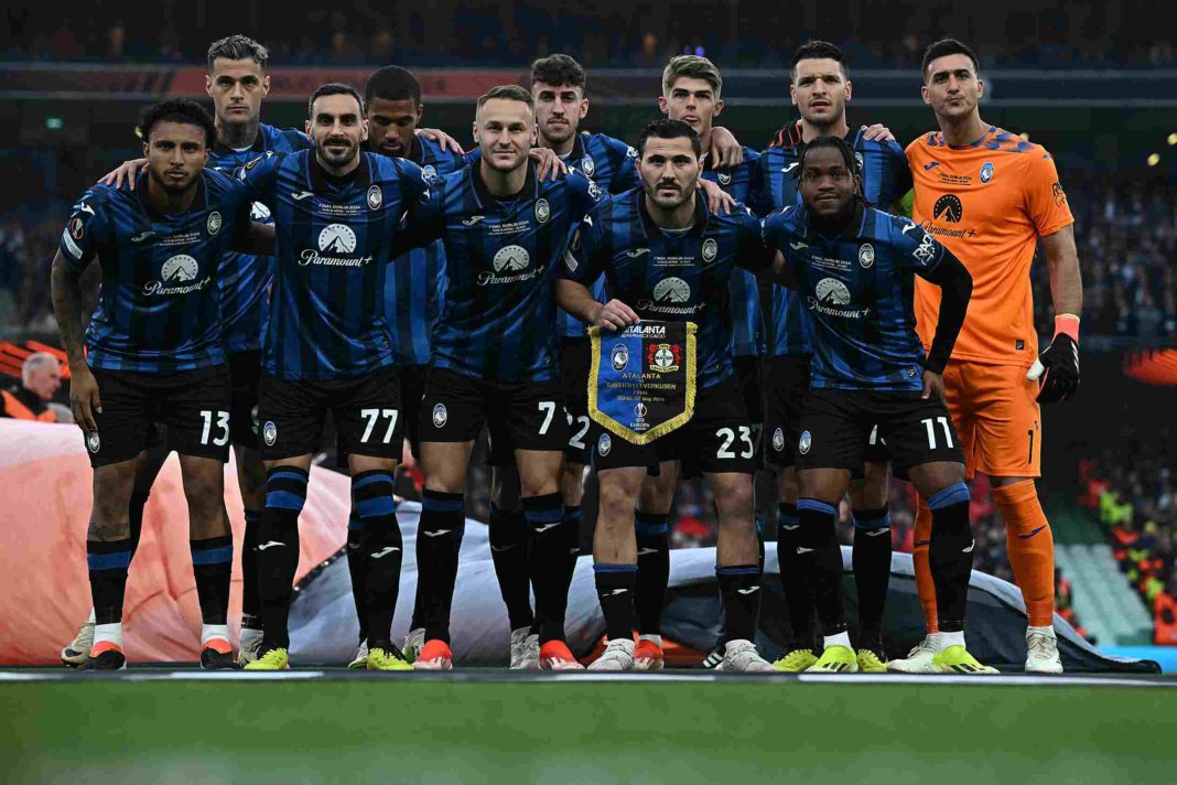 (back row L-R) Atalanta's Italian forward #90 Gianluca Scamacca, Atalanta's Swedish defender #04 Isak Hien, Atalanta's Italian defender #22 Matteo Ruggeri, Atalanta's Belgian midfielder #17 Charles De Ketelaere, Atalanta's Albanian defender #19 Berat Djimsiti and Atalanta's Argentine goalkeeper #01 Juan Musso, (front row L-R) Atalanta's Brazilian midfielder #13 Ederson, Atalanta's Italian defender #77 Davide Zappacosta, Atalanta's Dutch midfielder #07 Teun Koopmeiners, Atalanta's Bosnian defender #23 Sead Kolasinac and Atalanta's Nigerian forward #11 Ademola Lookman pose for a team photo ahead of kick-off in the UEFA Europa League final football match between Atalanta and Bayer Leverkusen at the Dublin Arena stadium, in Dublin, on May 22, 2024. (Photo by Paul ELLIS / AFP) (Photo by PAUL ELLIS/AFP via Getty Images)