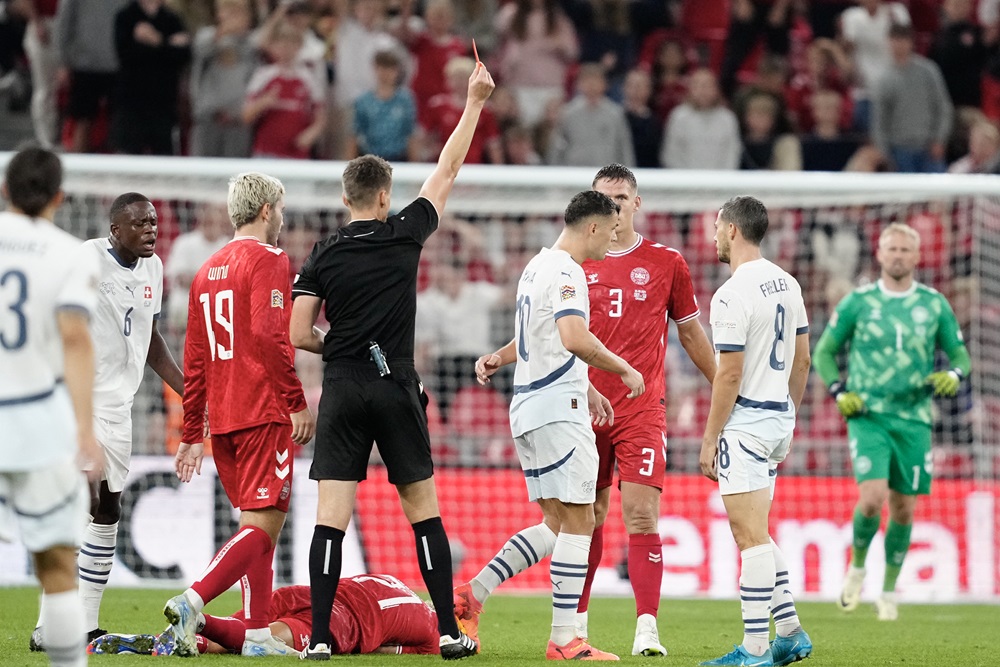 Switzerland's Granit Xhaka (4th) is shown a red card by the referee during the UEFA Nations League football match League A, Group A4, Day 1, Denmark v Switzerland in the Parken stadium in Copenhagen, Denmark, on September 5, 2024. (Photo by MADS CLAUS RASMUSSEN/Ritzau Scanpix/AFP via Getty Images)