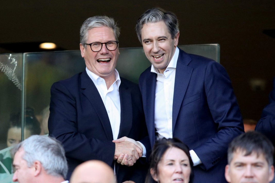 Ireland's Prime Minister Simon Harris (R) and Britain's Prime Minister Keir Starmer react in the stands during the UEFA Nations League, League B, group 2, football match between Ireland and England at the Aviva Stadium, in Dublin, on September 7, 2024. (Photo by PAUL FAITH/AFP via Getty Images)