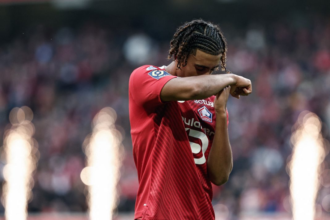 Lille's French defender #15 Leny Yoro celebrates after scoring his team's first goal during the French L1 football match between Lille OSC (LOSC) and Toulouse FC (TFC) at the Stade Pierre-Mauroy in Villeneuve-d'Ascq, northern France on November 12, 2023. (Photo by SAMEER AL-DOUMY/AFP via Getty Images)