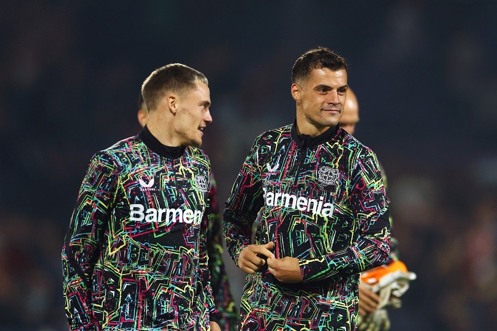 ROTTERDAM, NETHERLANDS: Florian Wirtz and Granit Xhaka of Bayer 04 Leverkusen react following the team's victory during the UEFA Champions League 2024/25 League Phase MD1 match between Feyenoord and Bayer 04 Leverkusen at De Kuip on September 19, 2024. (Photo by Dean Mouhtaropoulos/Getty Images)