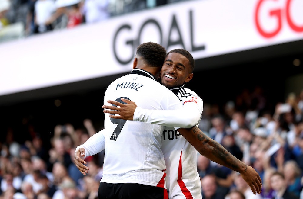 LONDON, ENGLAND: Reiss Nelson of Fulham celebrates with Rodrigo Muniz after scoring his team's third goal during the Premier League match between Fulham FC and Newcastle United FC at Craven Cottage on September 21, 2024. (Photo by Ryan Pierse/Getty Images)