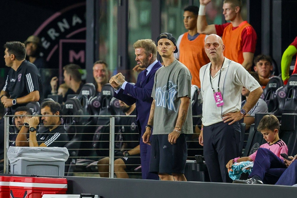 FORT LAUDERDALE, FLORIDA: Inter Miami CF owner David Beckham (L) and his son Romeo Beckham look on at the Inter Miami CF v Toronto FC: Round of 32 - Leagues Cup 2024 game at Chase Stadium on August 8, 2024. (Photo by Chris Arjoon/Getty Images)