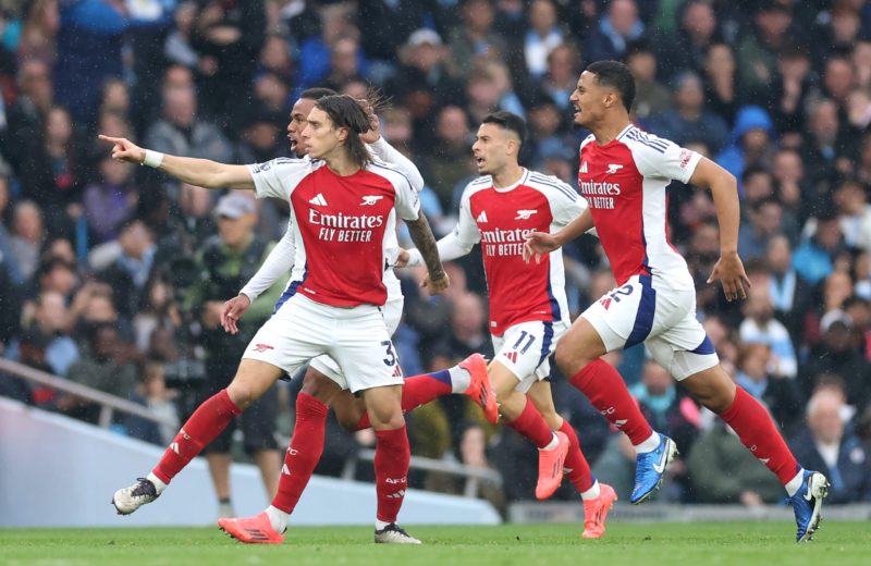 MANCHESTER, ENGLAND - SEPTEMBER 22: Riccardo Calafiori of Arsenal celebrates scoring his team's first goal with teammates during the Premier League match between Manchester City FC and Arsenal FC at Etihad Stadium on September 22, 2024 in Manchester, England. (Photo by Carl Recine/Getty Images)