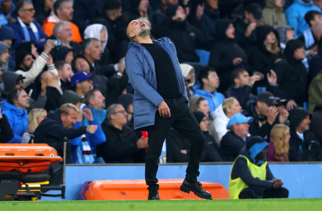 MANCHESTER, ENGLAND - SEPTEMBER 22: Josep Guardiola, Manager of Manchester City, reacts during the Premier League match between Manchester City FC and Arsenal FC at Etihad Stadium on September 22, 2024 in Manchester, England. (Photo by Carl Recine/Getty Images)